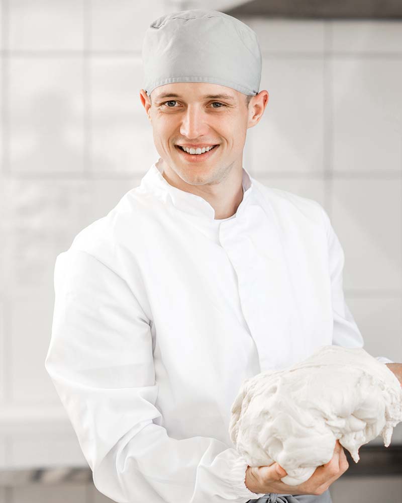 baker-mixing-dough-at-the-manufacturing-CZWD69R.jpg